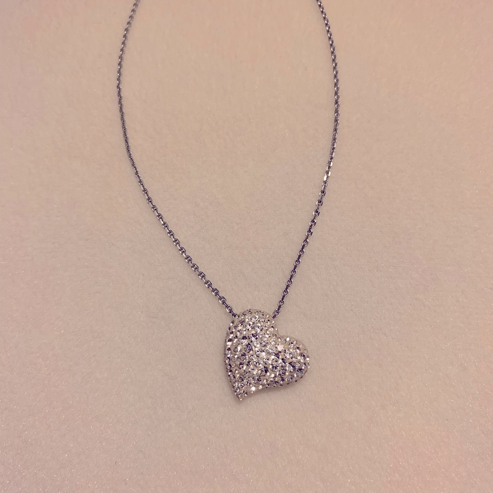 Swarovski necklace with puffy heart pendant
covered in crystals.